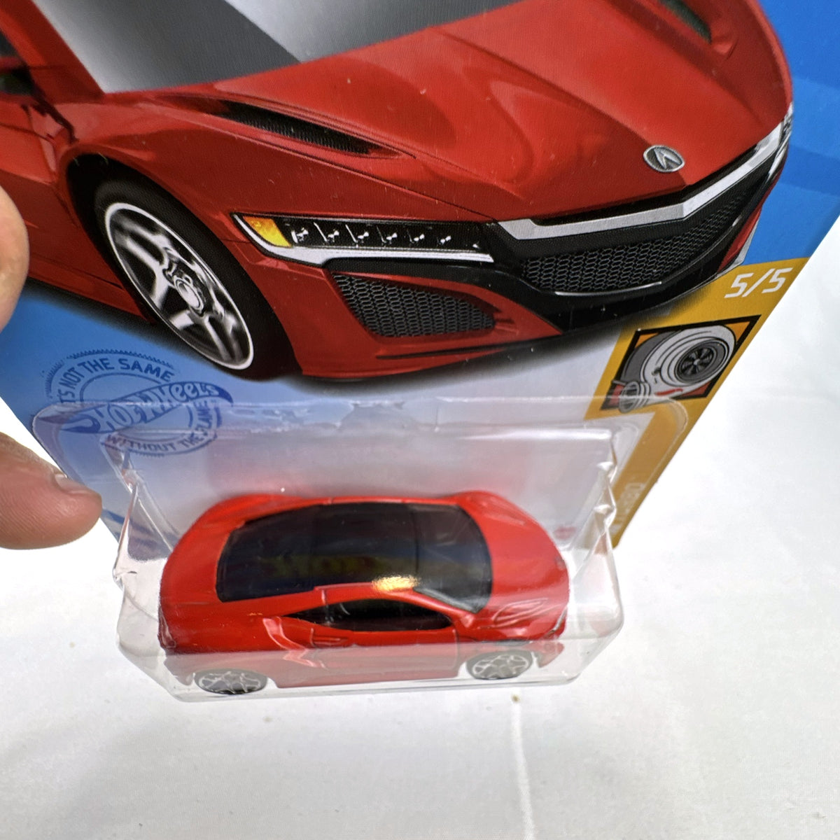 Hot Wheels 2017 Acura NSX 1:64 scale diecast car in gloss red on original blister card