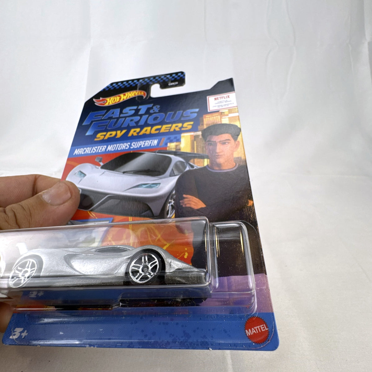 Hot Wheels Fast & Furious Spy Racers Macalister Motors Superfin diecast car in silver, 1:64 scale on blister card