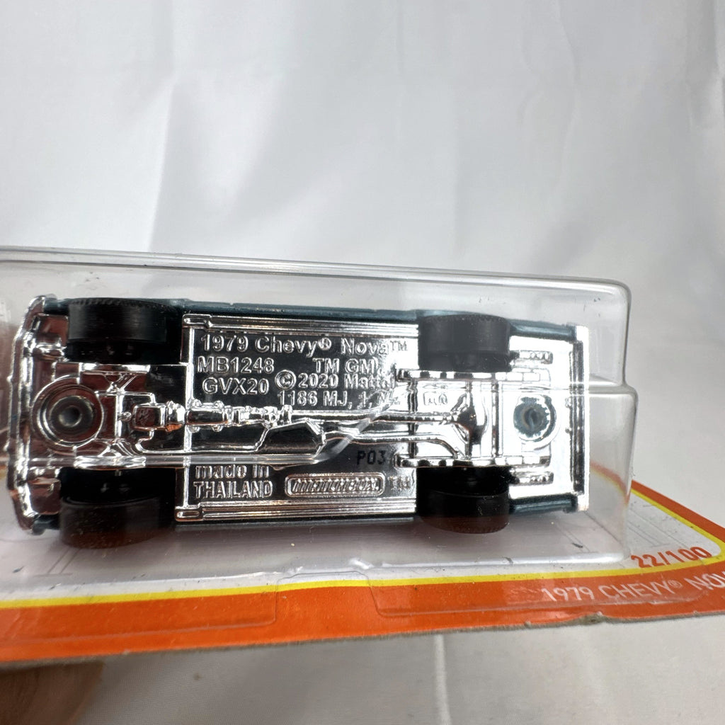 Matchbox 1979 Chevrolet Nova 1:64 scale diecast car in metallic blue with white hood stripes