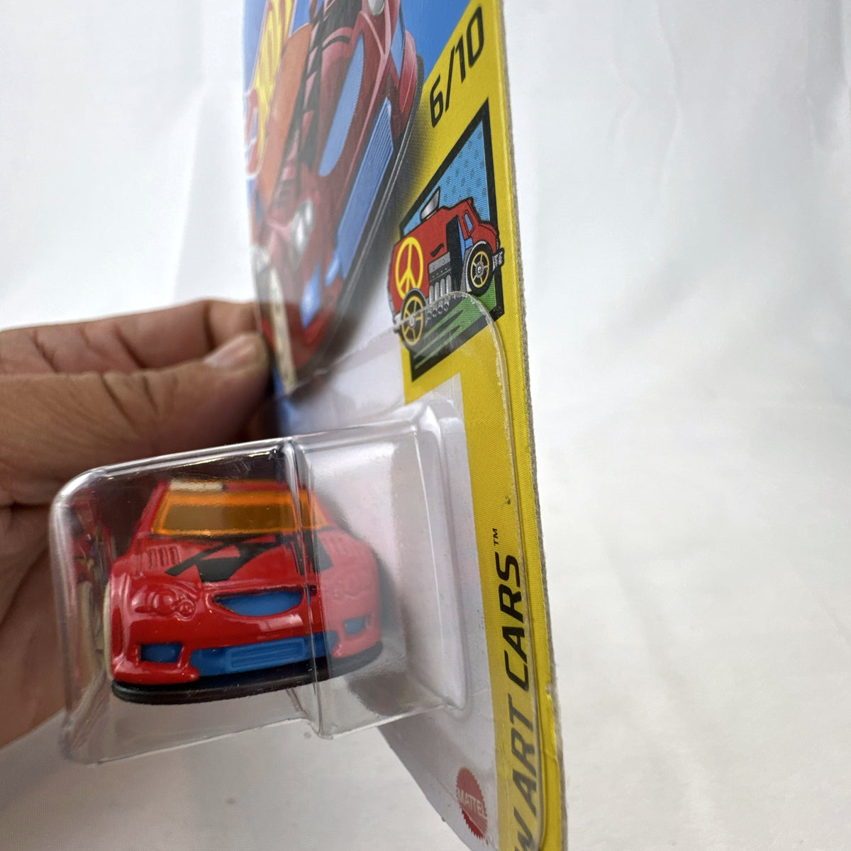 Hot Wheels 1:64 scale Audacious diecast wagon in red with HW Art Cars graphics sealed on card