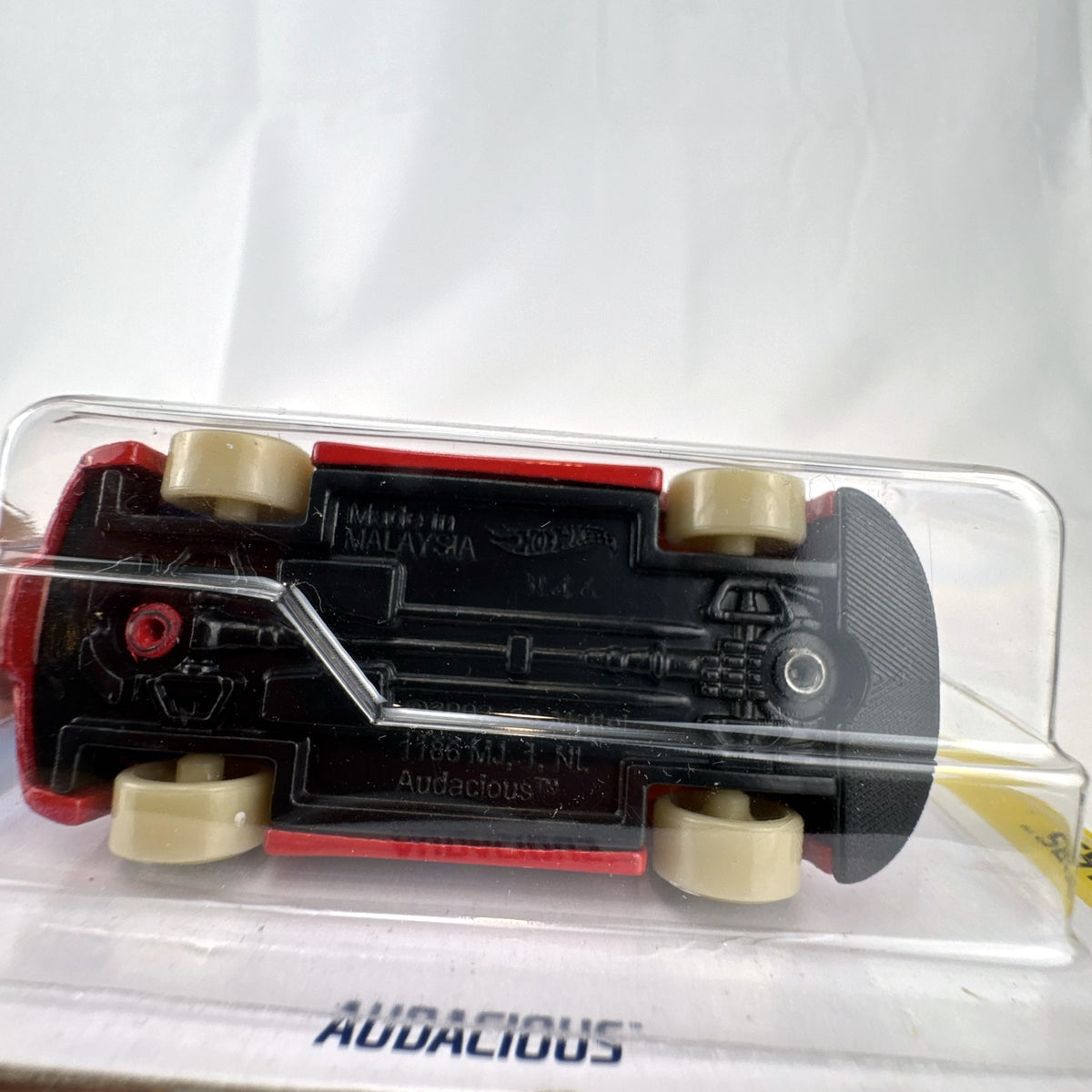 Hot Wheels 1:64 scale Audacious diecast wagon in red with HW Art Cars graphics sealed on card