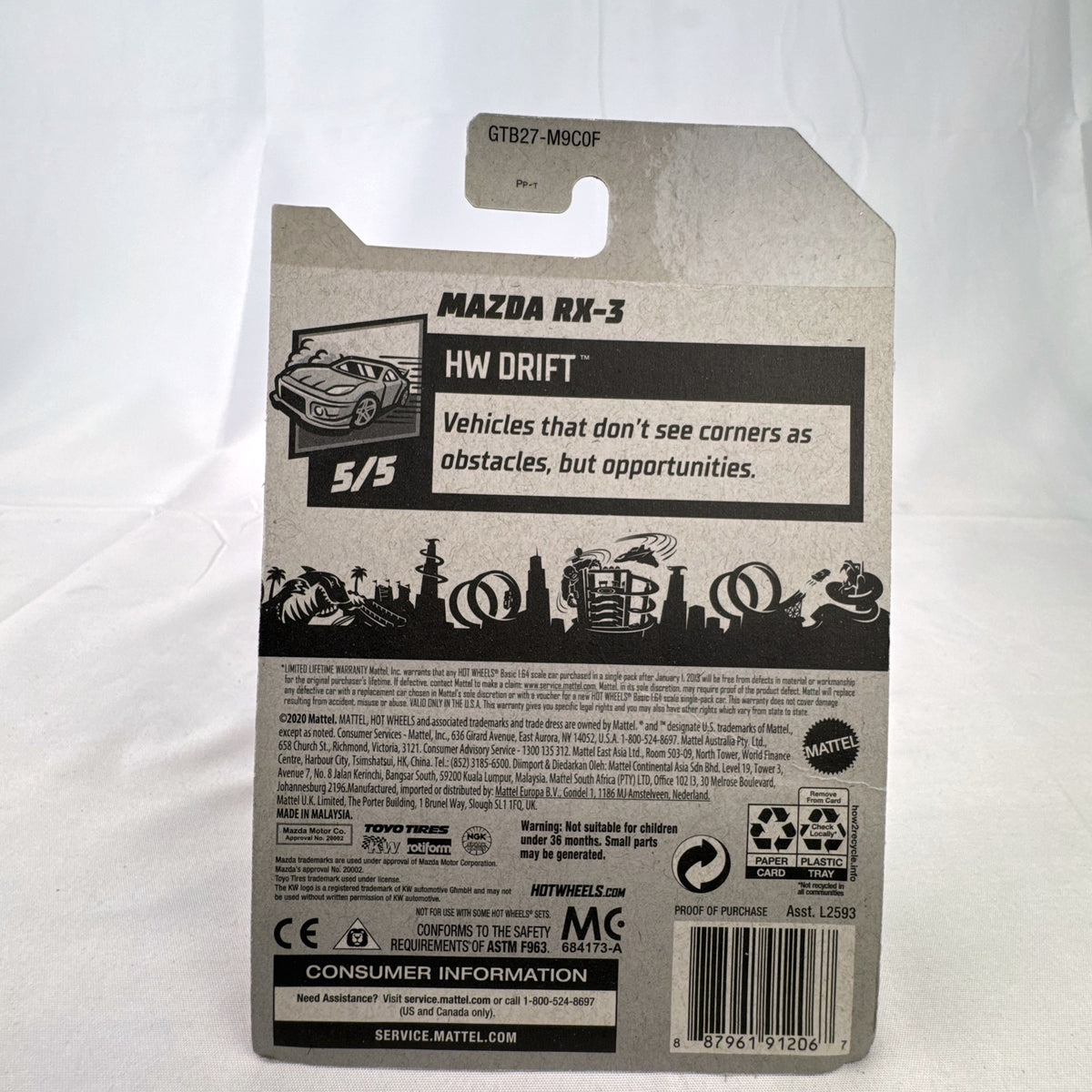 White Hot Wheels 1:64 scale Mazda RX-3 diecast car in Mad Mike HW Drift livery sealed on card.