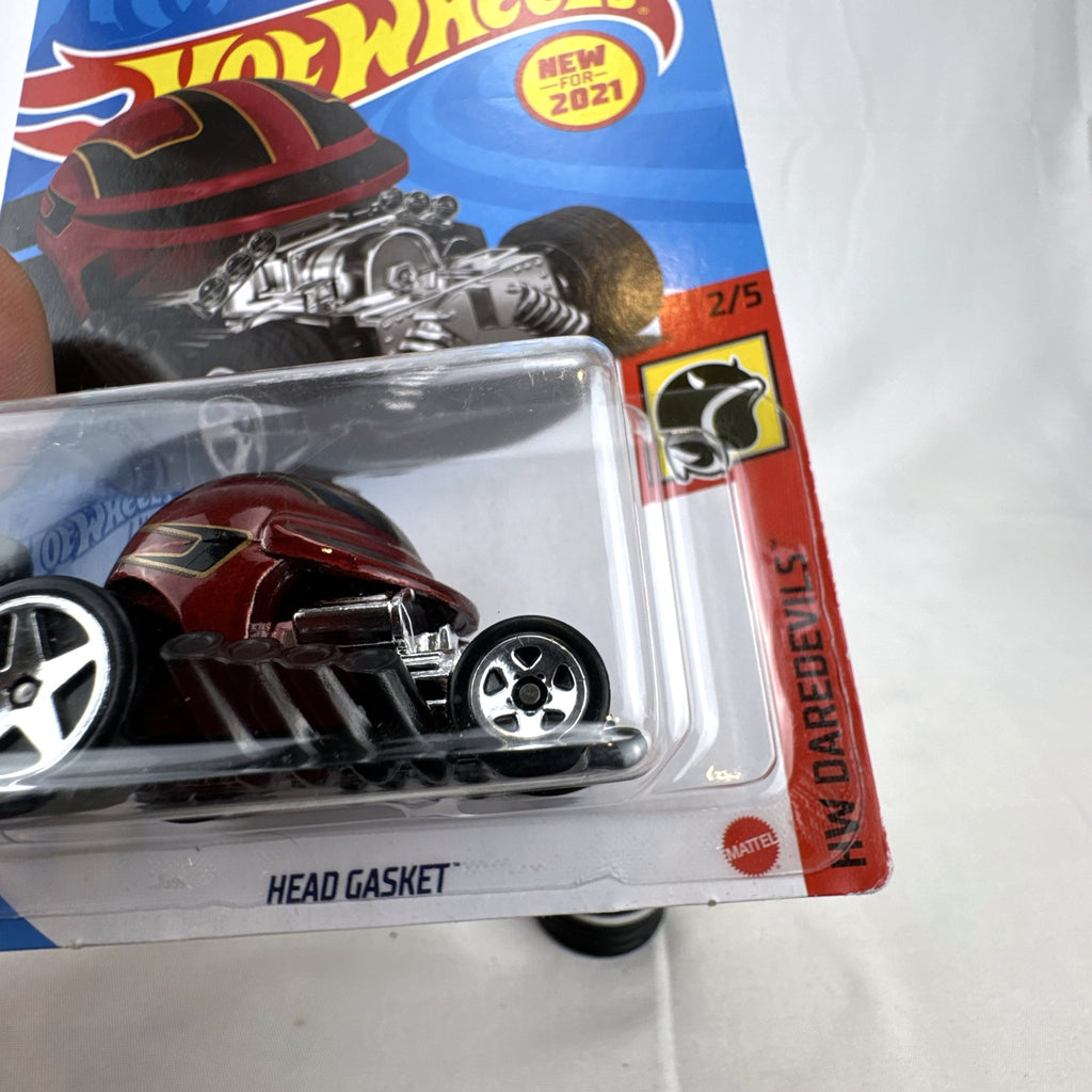 Hot Wheels Head Gasket 1:64 diecast stunt car in metallic red from the HW Daredevils series