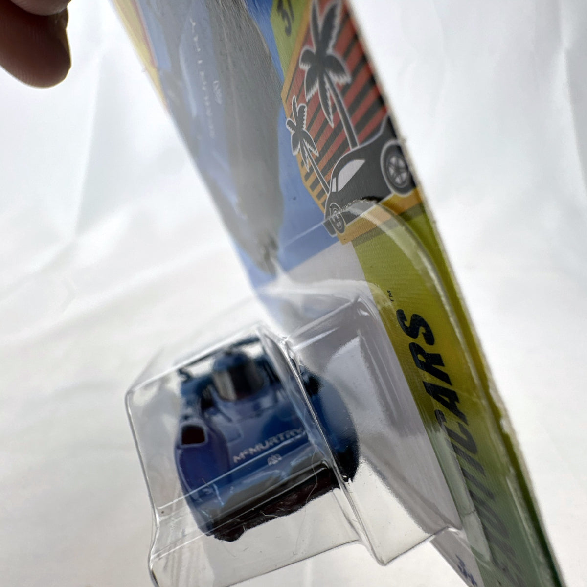 Hot Wheels McMurtry Speirling 1:64 scale diecast car in metallic blue, factory sealed on card