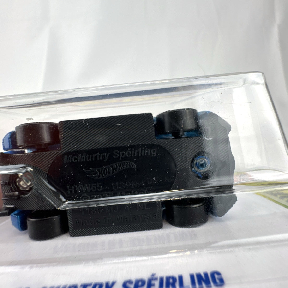 Hot Wheels McMurtry Speirling 1:64 scale diecast car in metallic blue, factory sealed on card