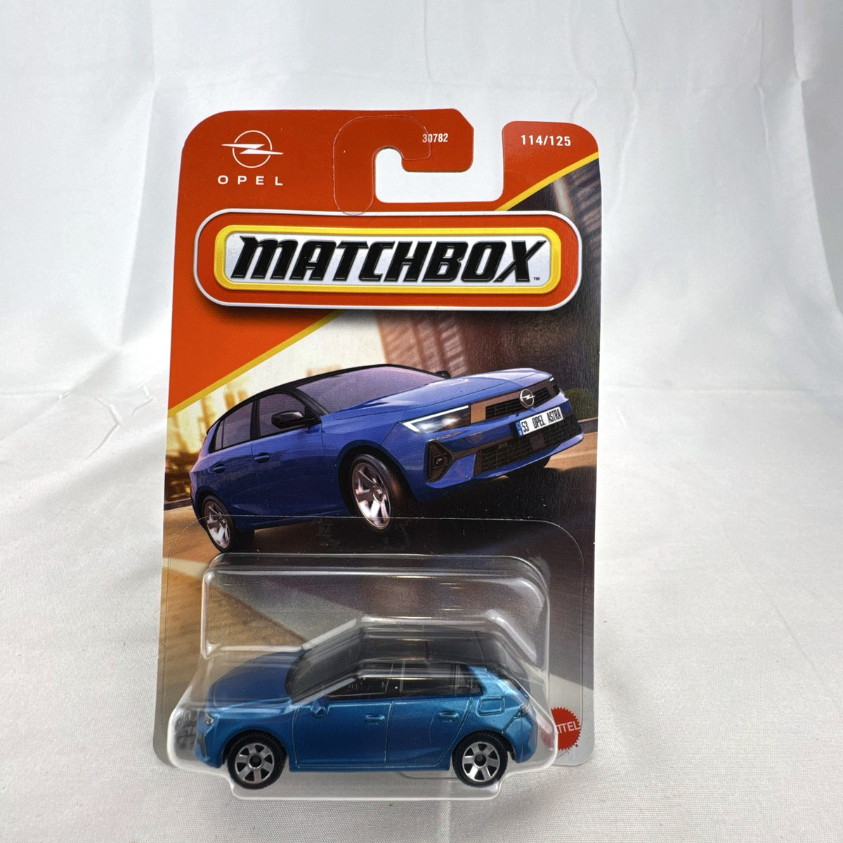 Matchbox 2022 Opel Astra 1:64 scale diecast car in metallic blue with black roof, factory sealed on blister card