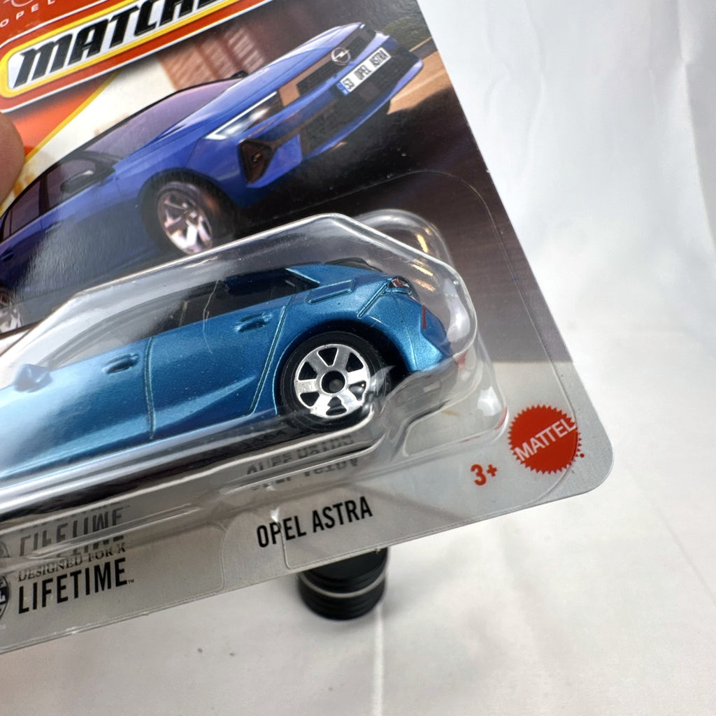 Matchbox 2022 Opel Astra 1:64 scale diecast car in metallic blue with black roof, factory sealed on blister card