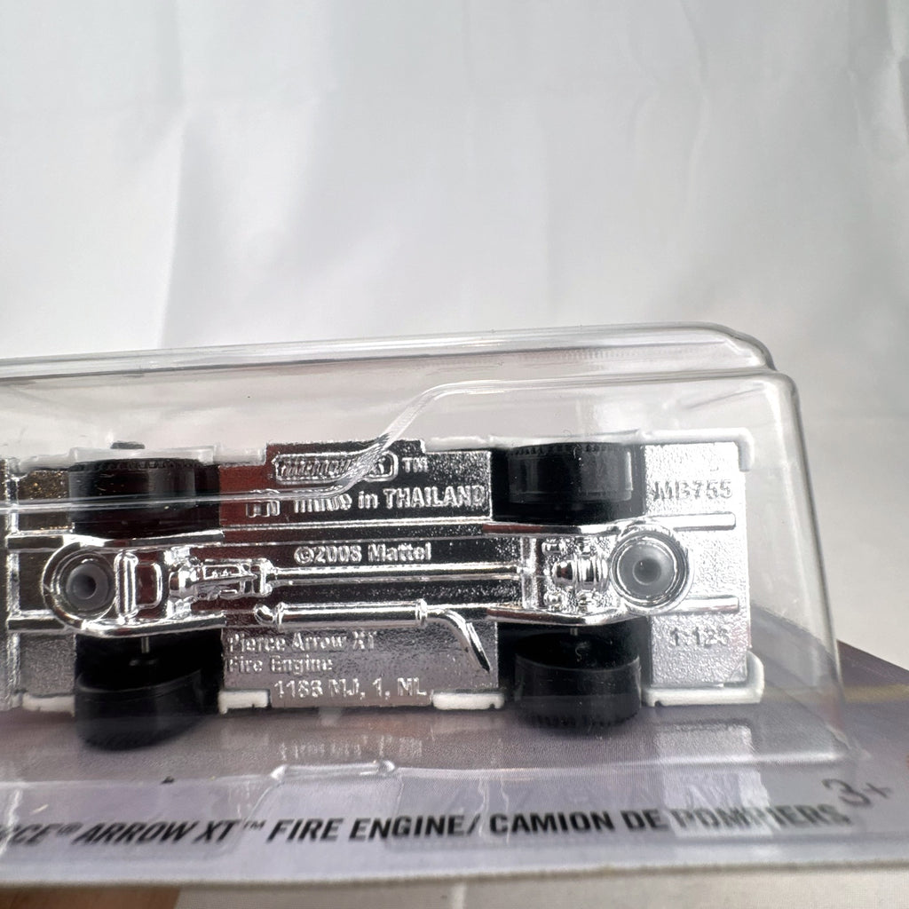Matchbox Pierce Arrow XT Fire Engine diecast truck in white and grey, factory sealed on original card 104/125.