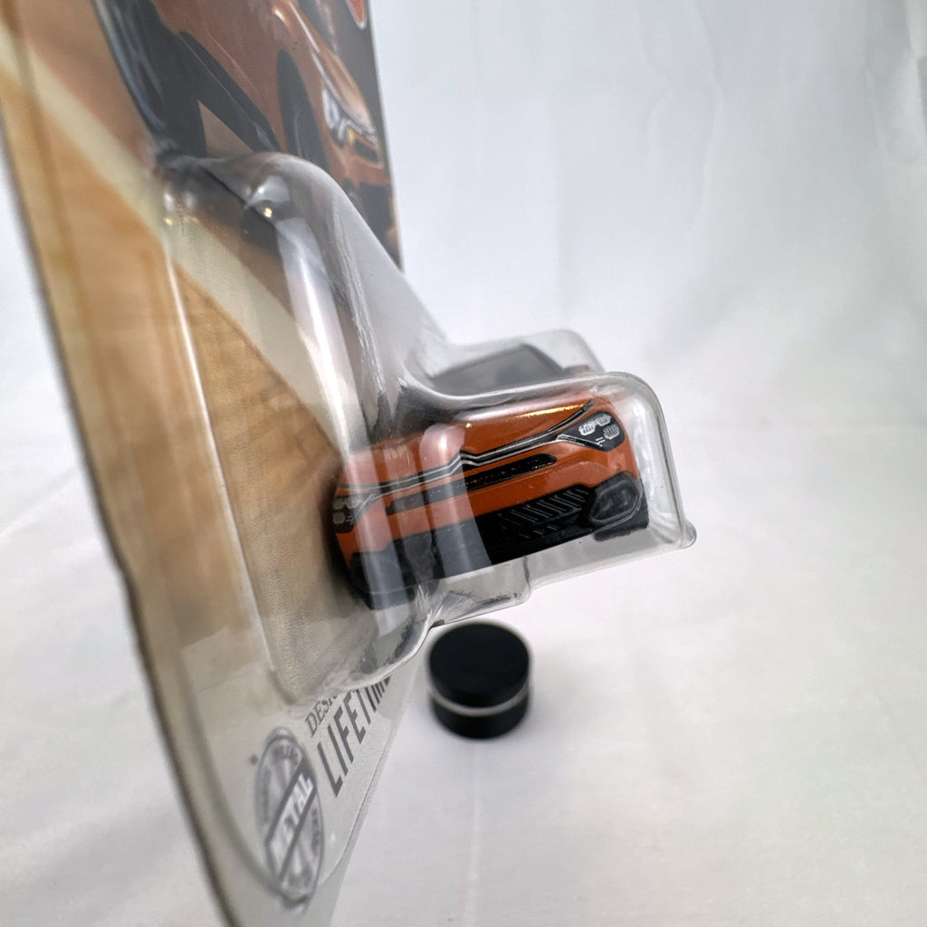 Sealed Matchbox 2023 Citroën ë-C4 1:64 scale diecast car in metallic orange on original packaging