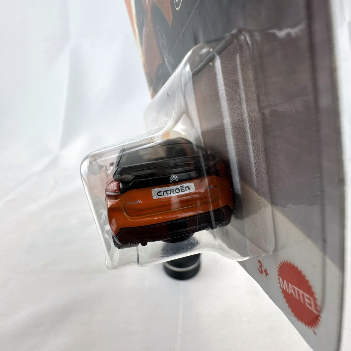 Sealed Matchbox 2023 Citroën ë-C4 1:64 scale diecast car in metallic orange on original packaging