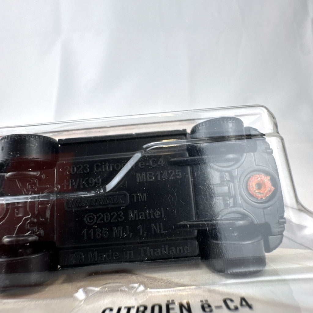 Sealed Matchbox 2023 Citroën ë-C4 1:64 scale diecast car in metallic orange on original packaging