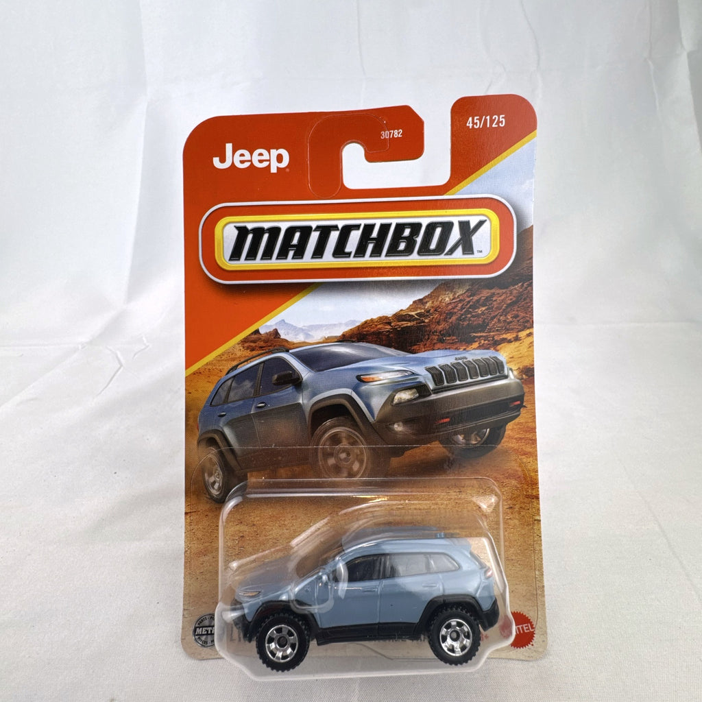 Matchbox 2014 Jeep Cherokee Trailhawk light blue 1:64 scale diecast model car sealed on original card