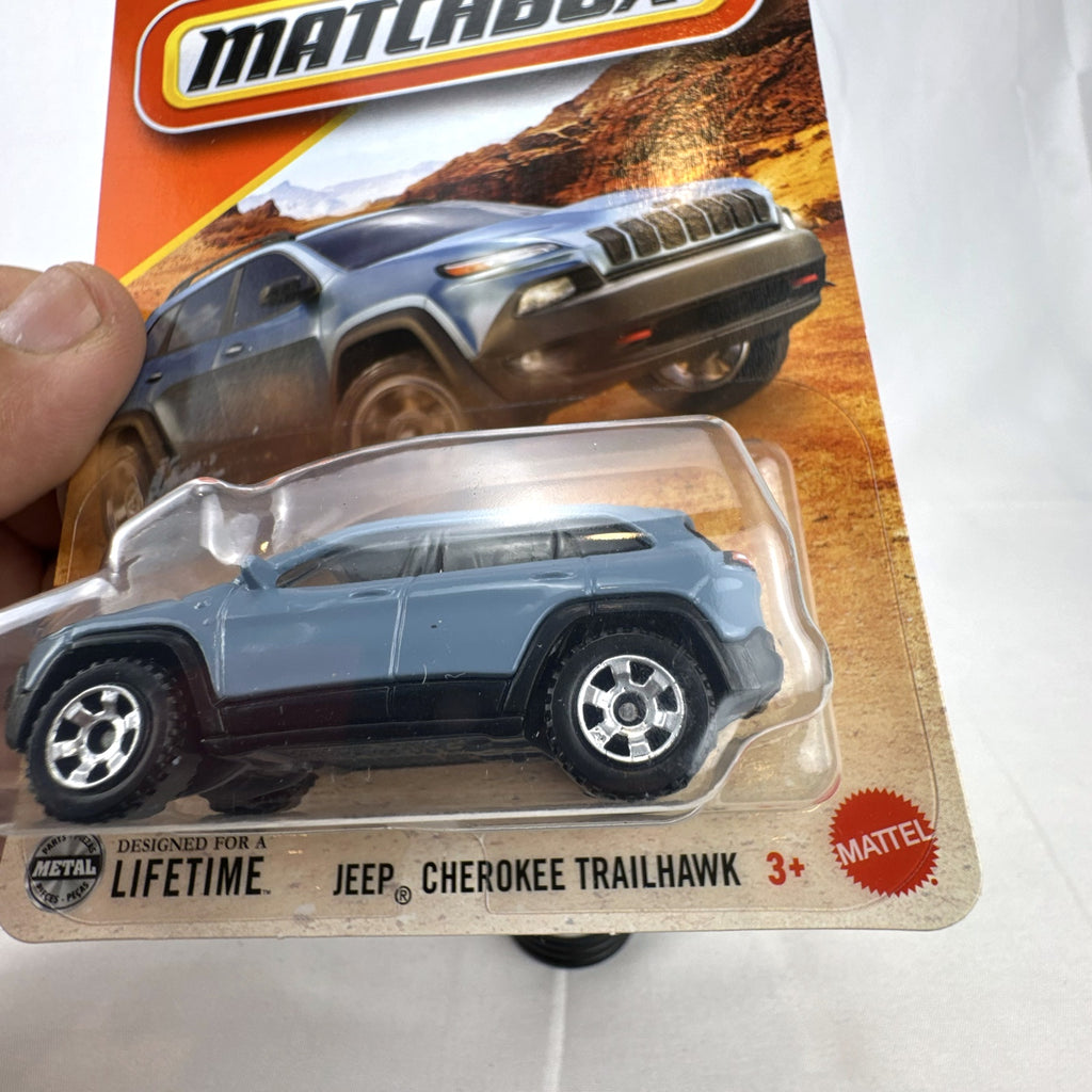Matchbox 2014 Jeep Cherokee Trailhawk light blue 1:64 scale diecast model car sealed on original card