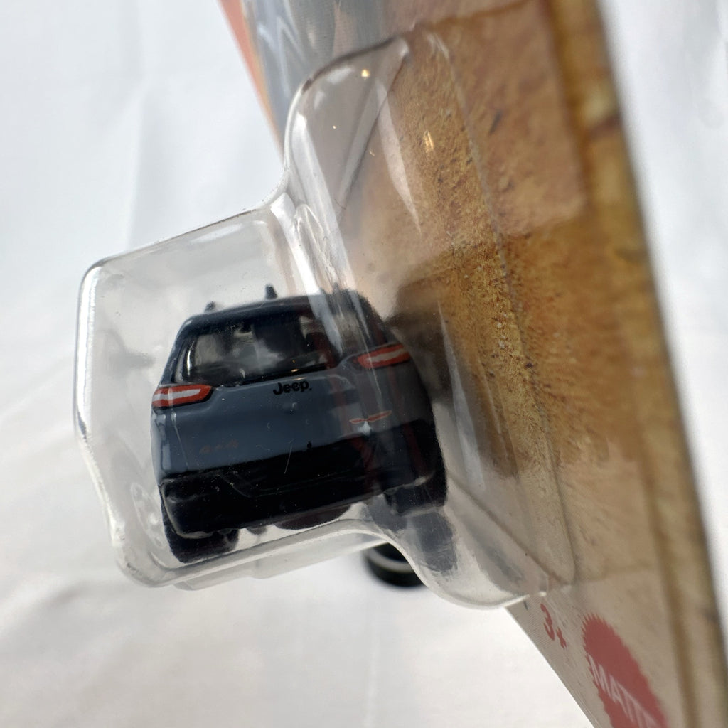 Matchbox 2014 Jeep Cherokee Trailhawk light blue 1:64 scale diecast model car sealed on original card