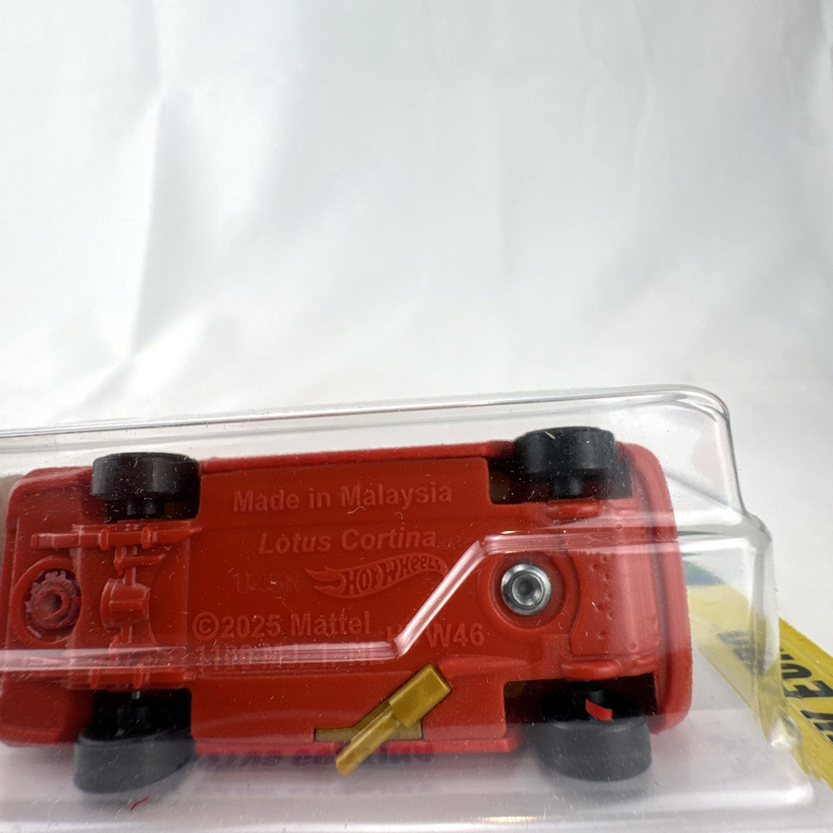 Hot Wheels Lotus Cortina HW Euro red diecast car in original sealed card packaging featuring Castrol #63 livery