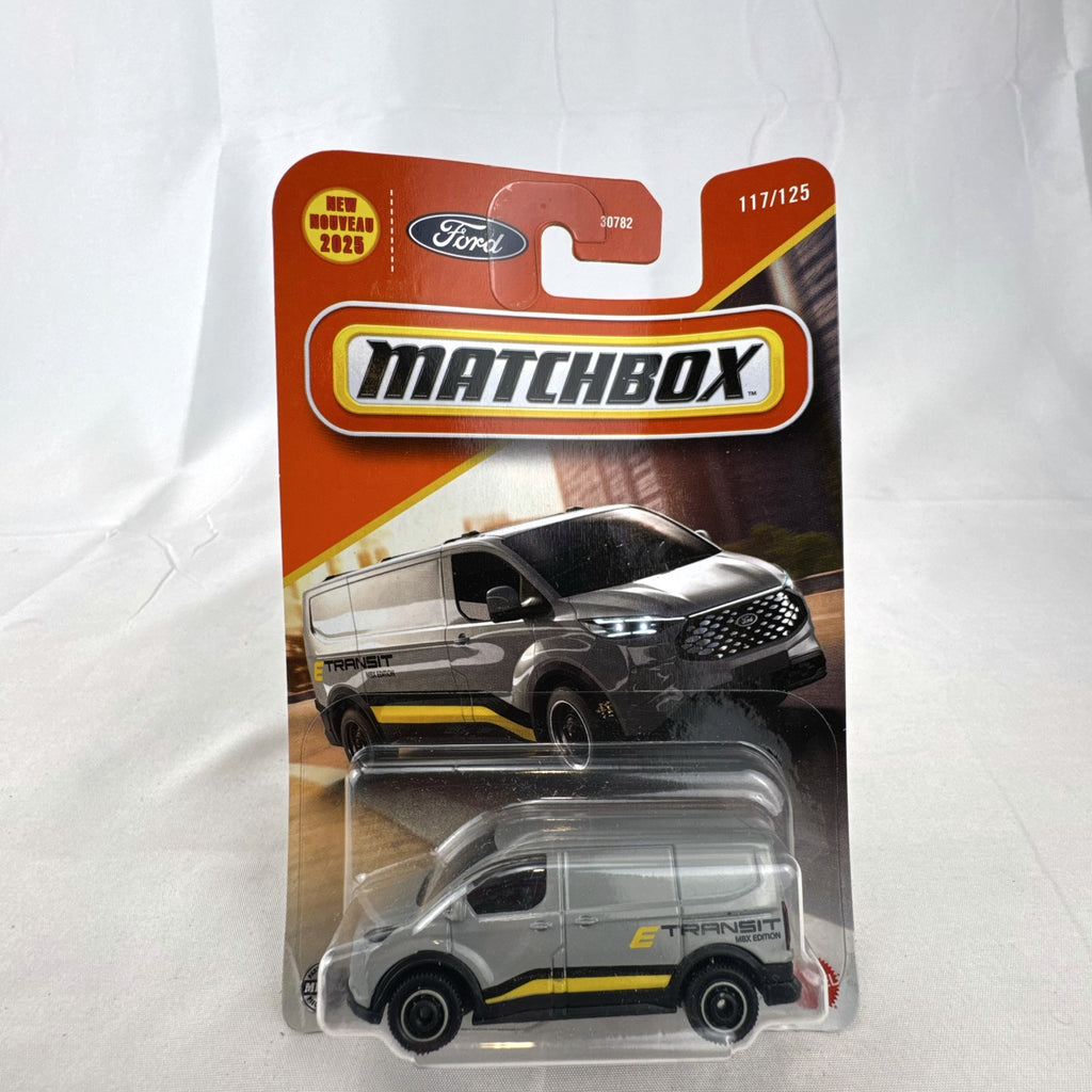 Matchbox 2023 Ford E-Transit Custom diecast van in gray with MBX Edition livery, sealed on card.