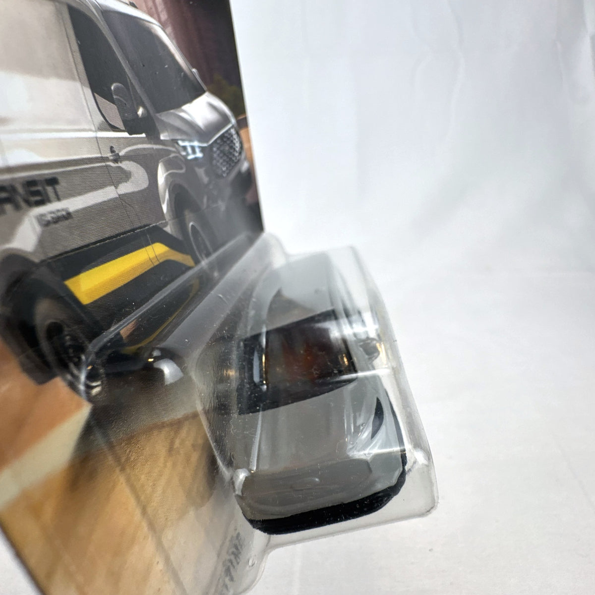 Matchbox 2023 Ford E-Transit Custom diecast van in gray with MBX Edition livery, sealed on card.