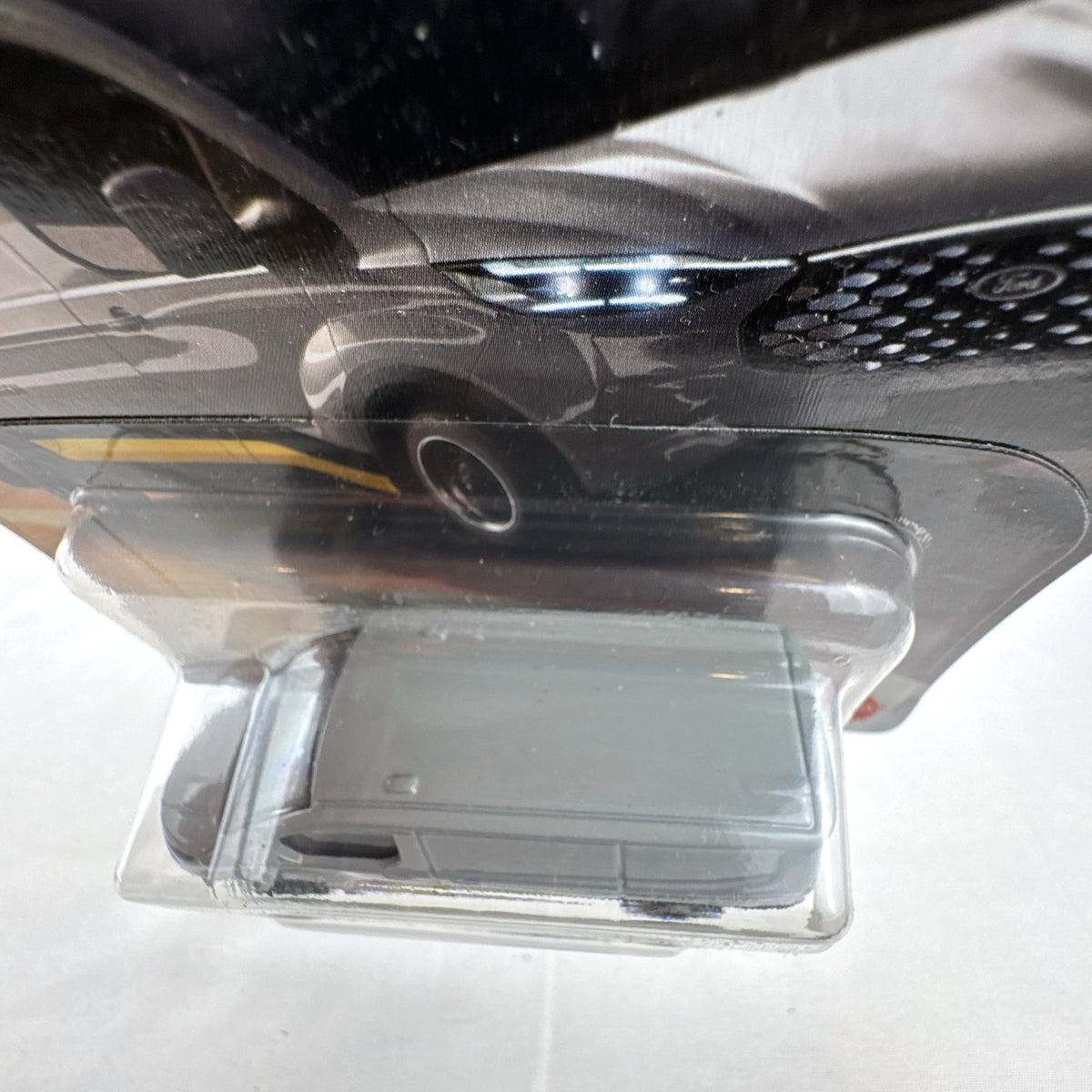 Matchbox 2023 Ford E-Transit Custom diecast van in gray with MBX Edition livery, sealed on card.