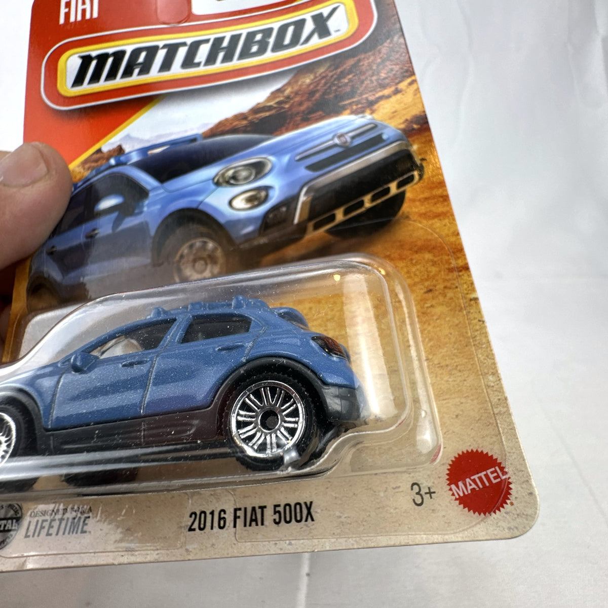 Matchbox 1:64 scale 2016 Fiat 500X diecast model car in metallic blue sealed on blister card