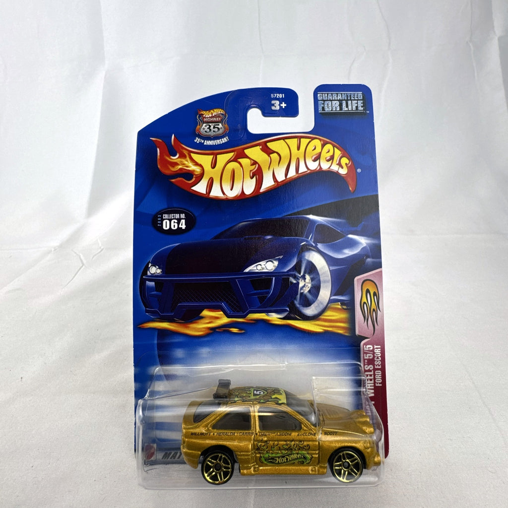 Hot Wheels 2003 35th Anniversary metallic gold Ford Escort Rally diecast car in sealed packaging