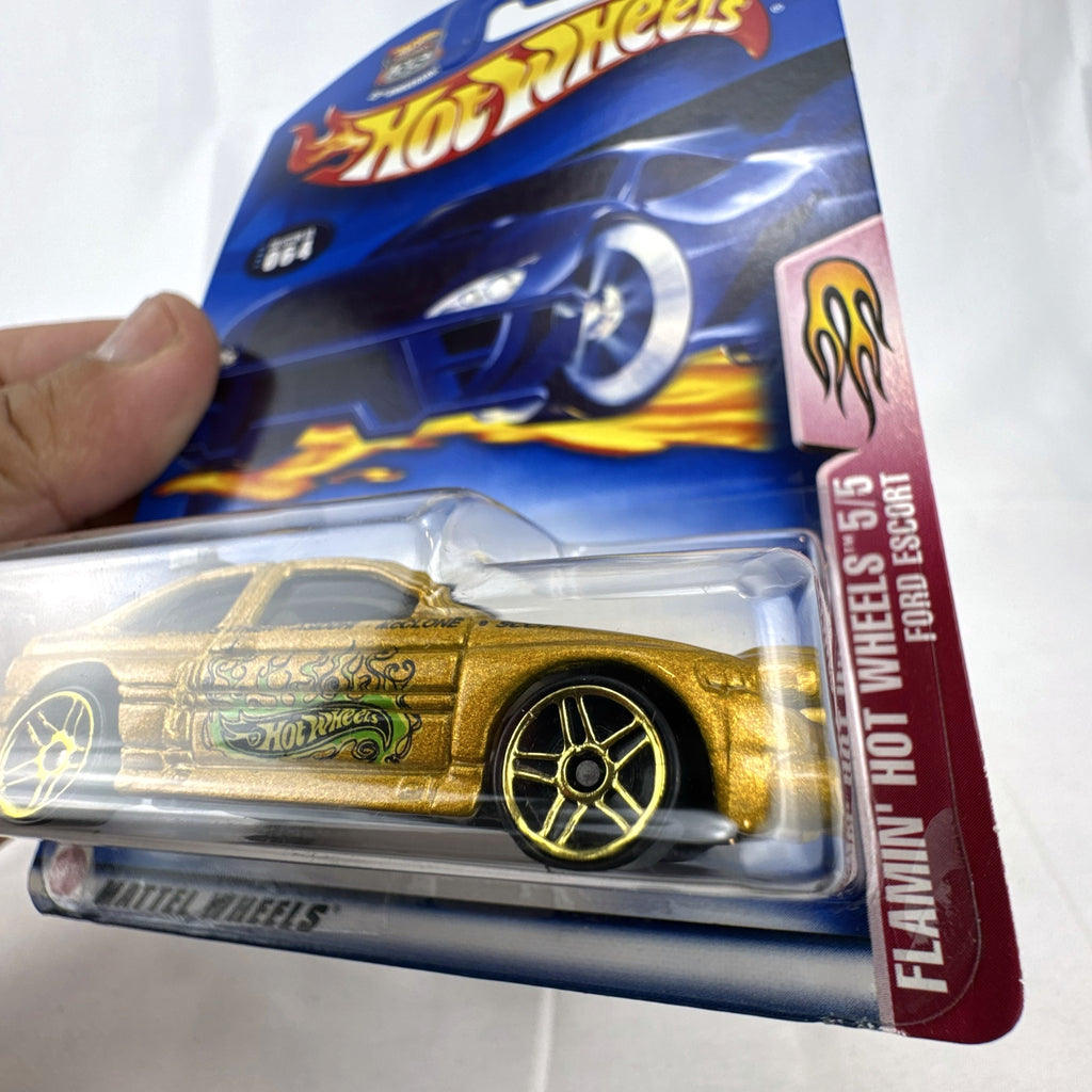 Hot Wheels 2003 35th Anniversary metallic gold Ford Escort Rally diecast car in sealed packaging