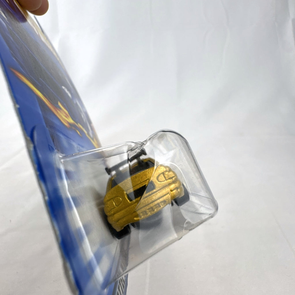 Hot Wheels 2003 35th Anniversary metallic gold Ford Escort Rally diecast car in sealed packaging