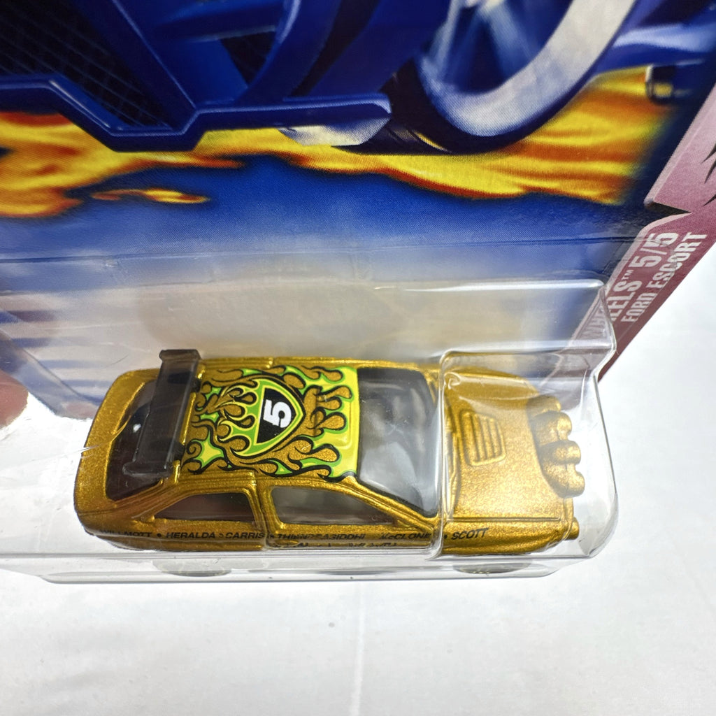 Hot Wheels 2003 35th Anniversary metallic gold Ford Escort Rally diecast car in sealed packaging