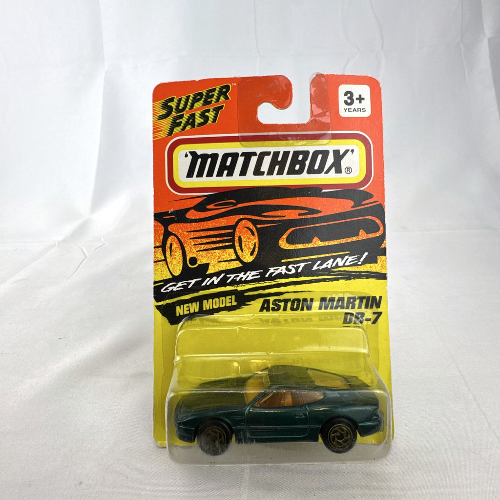 Sealed 1993 Matchbox Super Fast Aston Martin DB-7 diecast car #59 in deep metallic green with original card packaging.