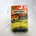 Sealed 1993 Matchbox Super Fast Aston Martin DB-7 diecast car #59 in deep metallic green with original card packaging.