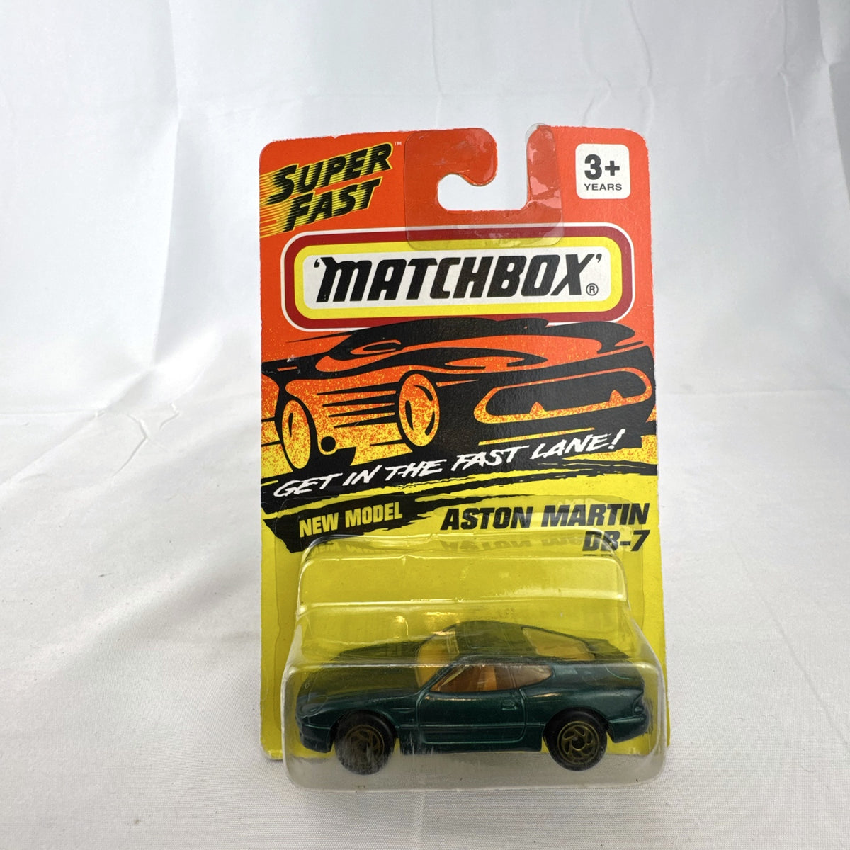 Sealed 1993 Matchbox Super Fast Aston Martin DB-7 diecast car #59 in deep metallic green with original card packaging.