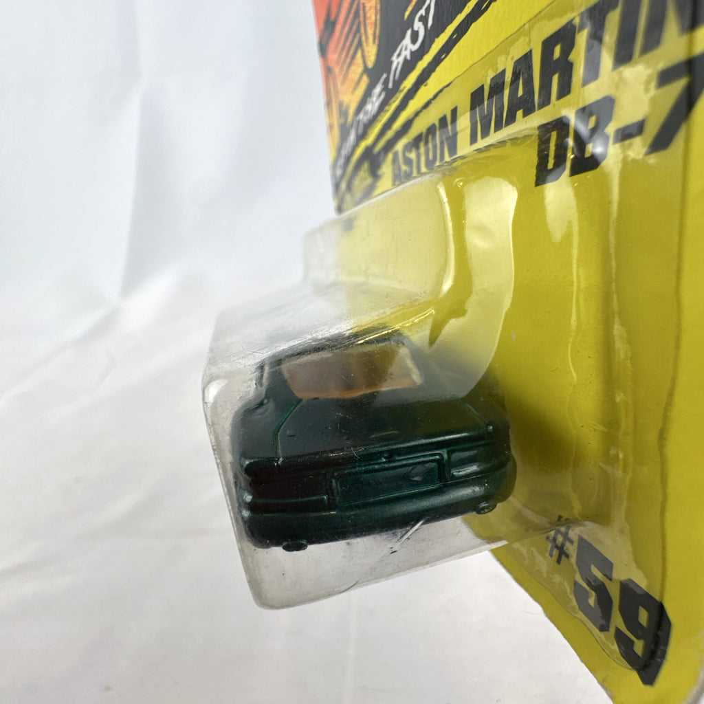Sealed 1993 Matchbox Super Fast Aston Martin DB-7 diecast car #59 in deep metallic green with original card packaging.