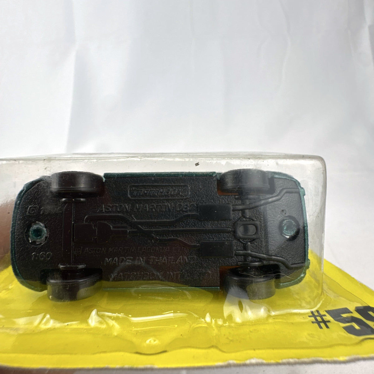 Sealed 1993 Matchbox Super Fast Aston Martin DB-7 diecast car #59 in deep metallic green with original card packaging.