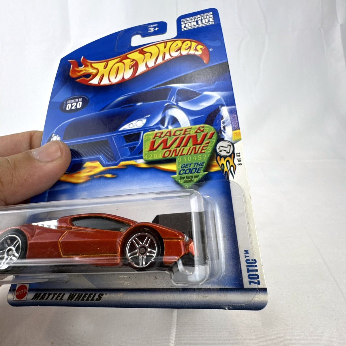 2003 Hot Wheels First Editions Zotic diecast concept car in metallic orange, factory sealed on blister card.