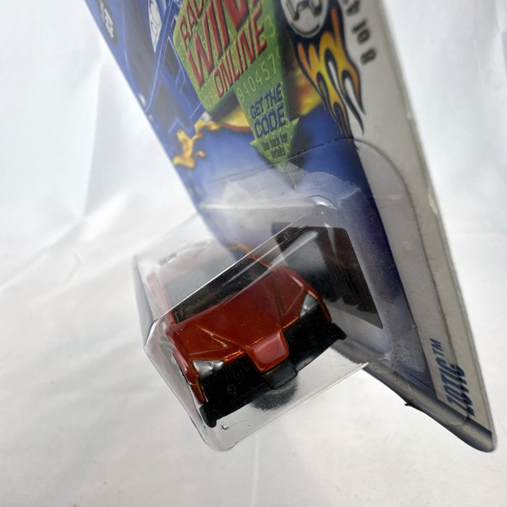 2003 Hot Wheels First Editions Zotic diecast concept car in metallic orange, factory sealed on blister card.