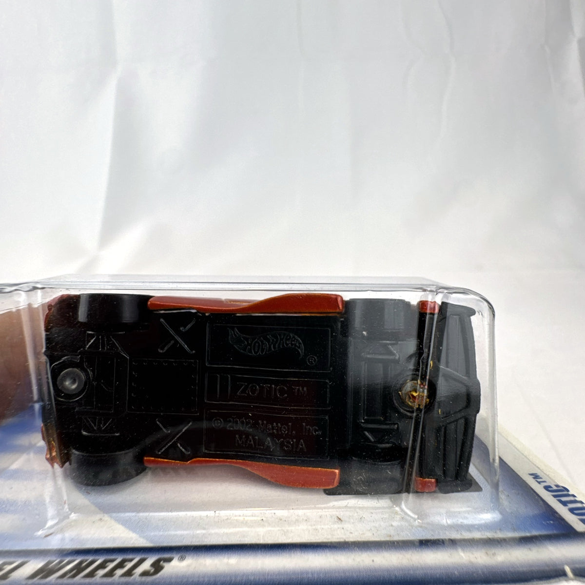 2003 Hot Wheels First Editions Zotic diecast concept car in metallic orange, factory sealed on blister card.