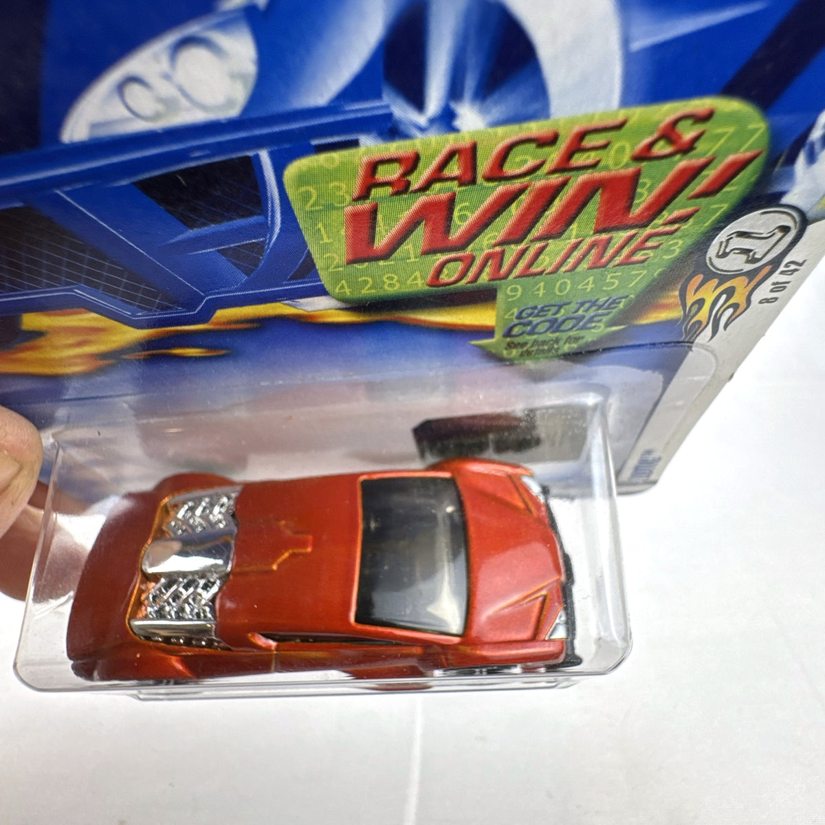 2003 Hot Wheels First Editions Zotic diecast concept car in metallic orange, factory sealed on blister card.