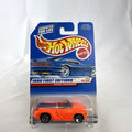 Factory sealed 1998 Hot Wheels First Editions Dodge Sidewinder diecast truck in neon orange on original card.