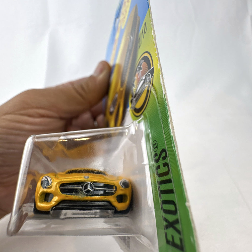 Sealed Hot Wheels 2017 HW Exotics 15 Mercedes-AMG GT diecast car in metallic yellow on original card