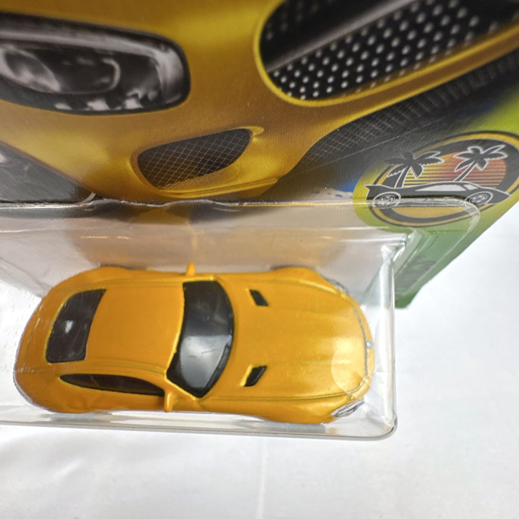 Sealed Hot Wheels 2017 HW Exotics 15 Mercedes-AMG GT diecast car in metallic yellow on original card