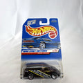 Sealed 1998 Hot Wheels First Editions Dodge Caravan diecast minivan in metallic purple on original card packaging.
