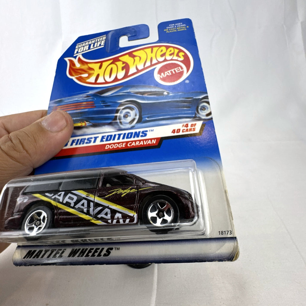 Sealed 1998 Hot Wheels First Editions Dodge Caravan diecast minivan in metallic purple on original card packaging.