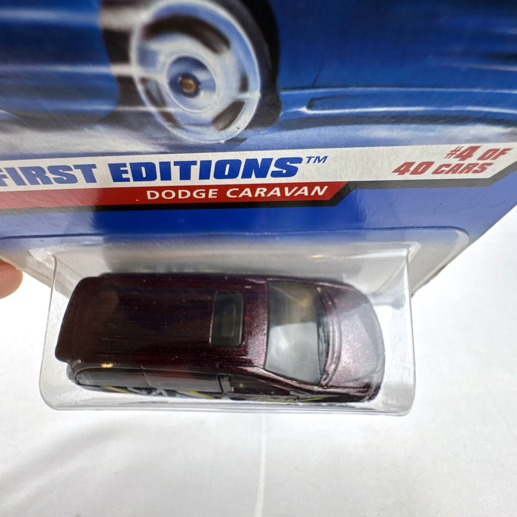 Sealed 1998 Hot Wheels First Editions Dodge Caravan diecast minivan in metallic purple on original card packaging.