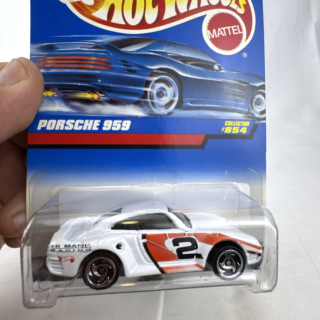 1998 Hot Wheels Porsche 959 diecast car in white Hi Bank Racing livery sealed on original #854 blue card.