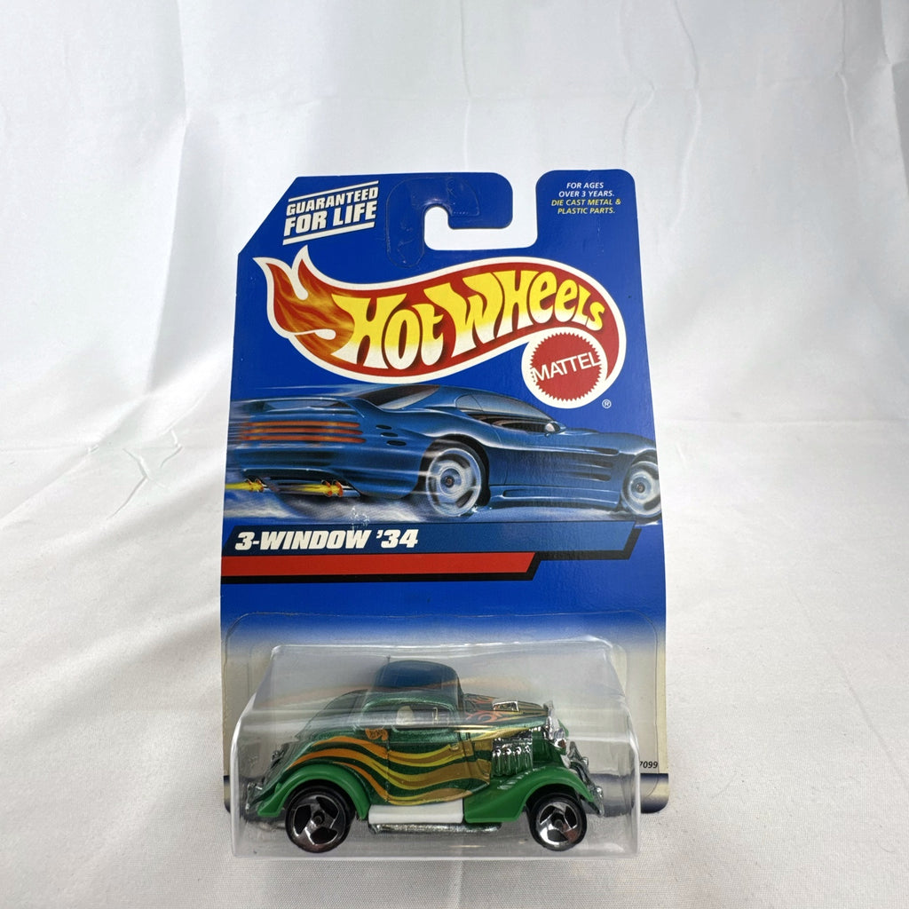Hot Wheels 2000 Mainline 3-Window '34 Ford Coupe diecast car in metallic green factory sealed on card