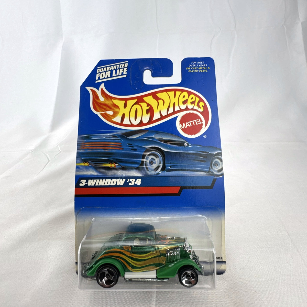 Hot Wheels 2000 Mainline 3-Window '34 Ford Coupe diecast car in metallic green factory sealed on card