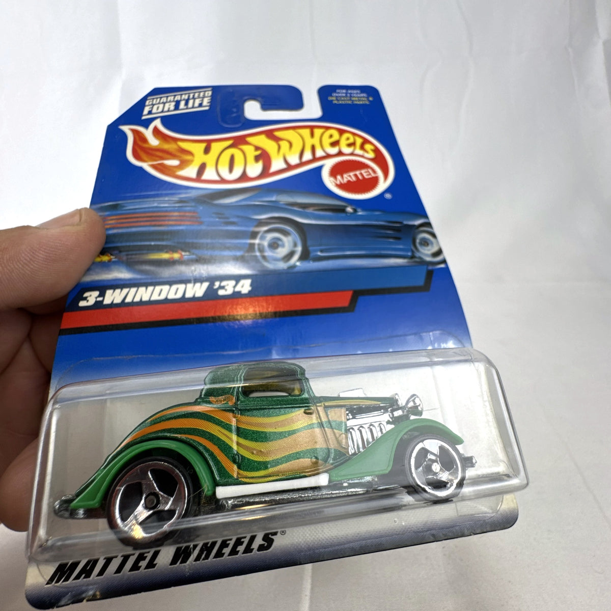 Hot Wheels 2000 Mainline 3-Window '34 Ford Coupe diecast car in metallic green factory sealed on card