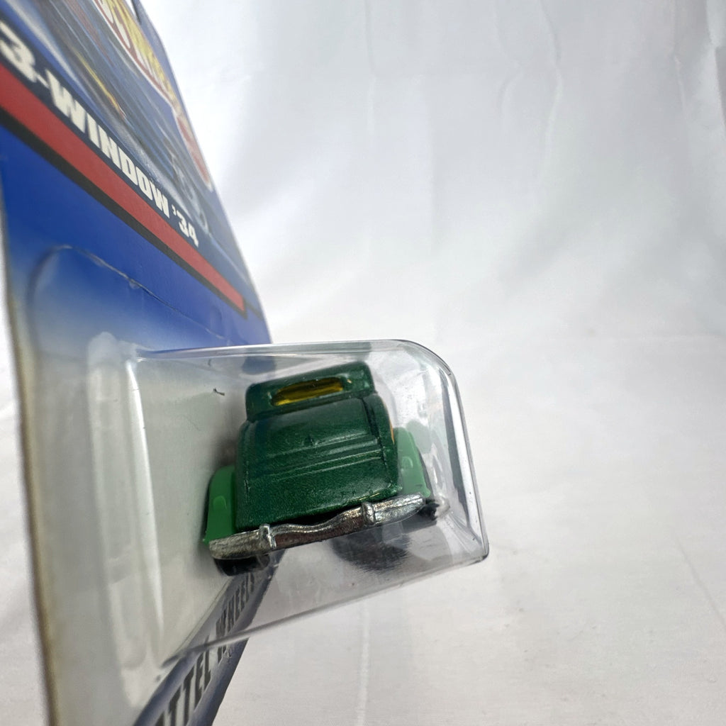 Hot Wheels 2000 Mainline 3-Window '34 Ford Coupe diecast car in metallic green factory sealed on card