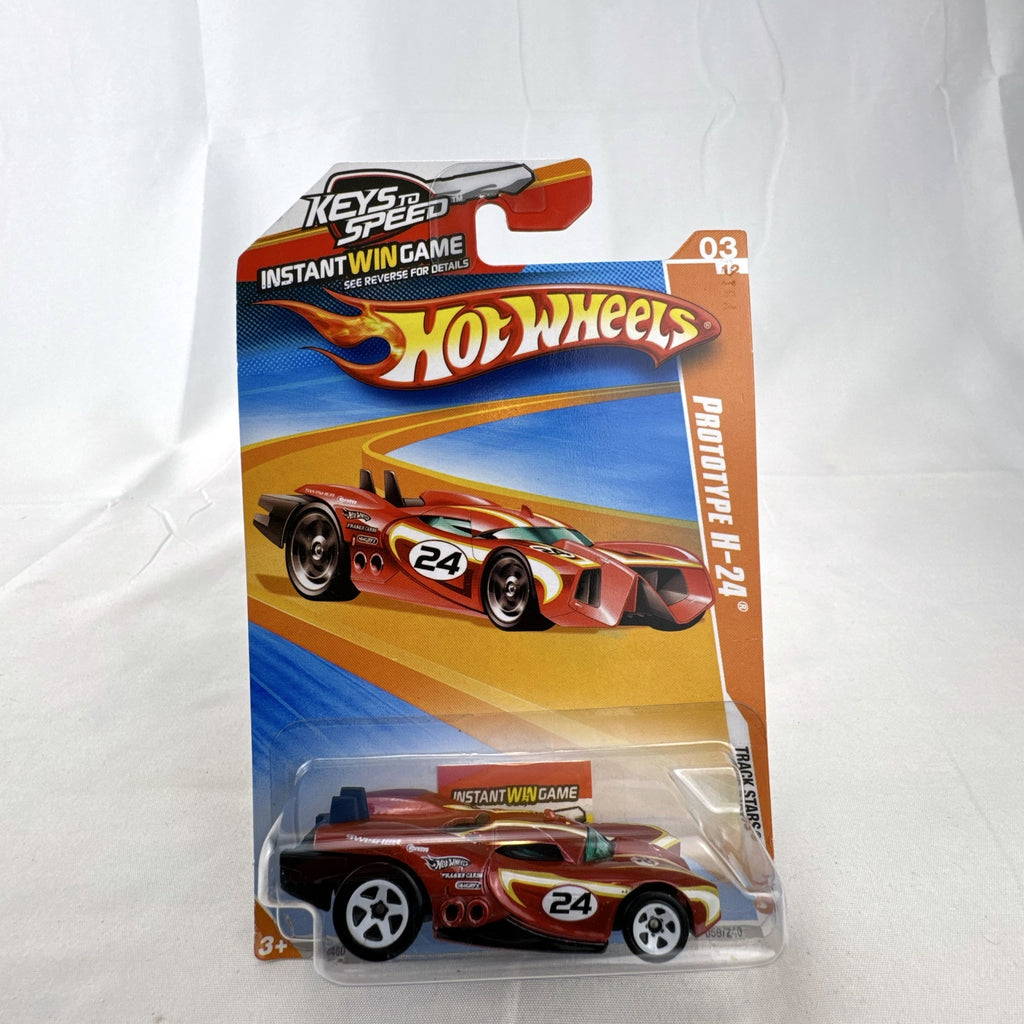 Sealed 2010 Hot Wheels Track Stars Prototype H-24 diecast car in dark metallic red on original blister card.
