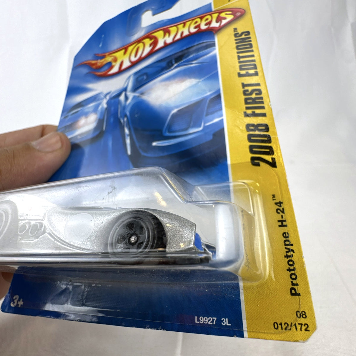 Sealed 2008 Hot Wheels First Editions Prototype H-24 diecast car in silver with blue racing stripes 1:64 scale