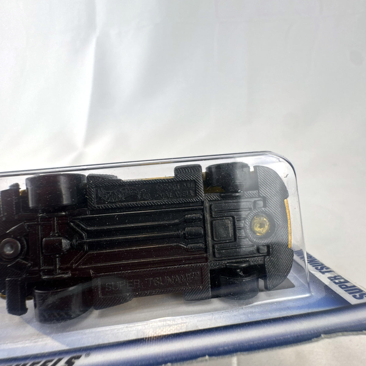 Sealed Hot Wheels 2002 First Editions Super Tsunami 1:64 diecast car in metallic gold on original card